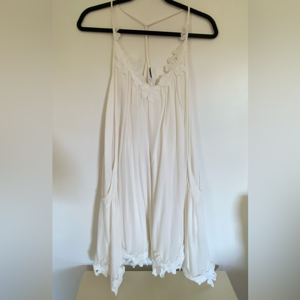 White sundress with flowers on neck